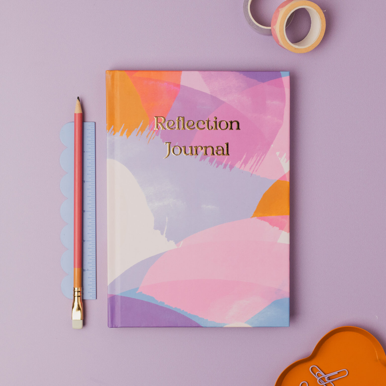 reflection journal with colourful cover and gold foil on lilac background